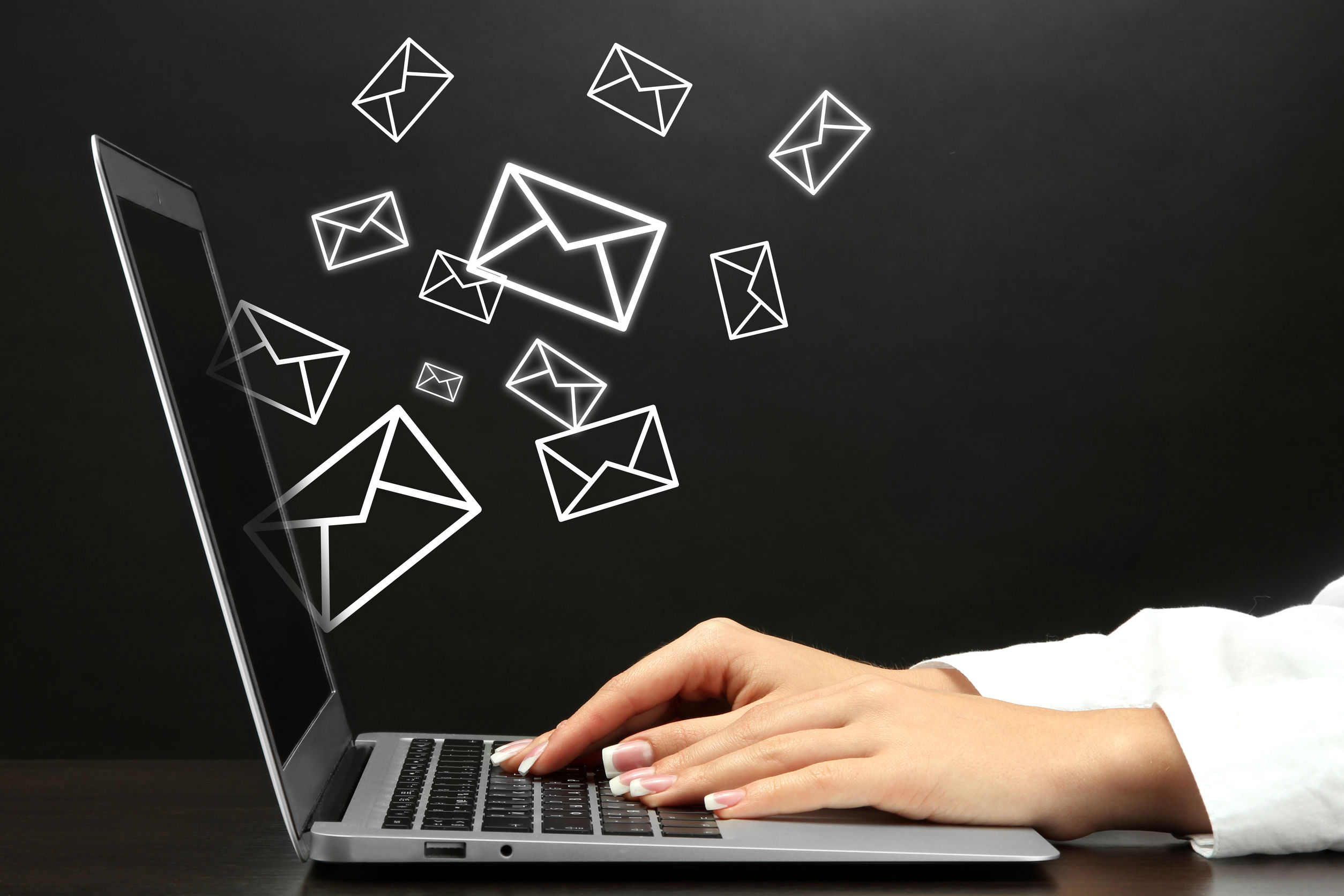 Email concept with laptop and hands